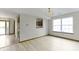 Bright living room features a large window and access to the front entrance at 5988 White Birch Dr, Fishers, IN 46038