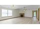 Spacious living room includes a fireplace and a large window for ample light at 5988 White Birch Dr, Fishers, IN 46038