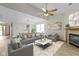 Bright living room featuring a fireplace, hardwood floors, and neutral decor at 5988 White Birch Dr, Fishers, IN 46038