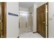 Enclosed shower with glass doors and tile surround at 5988 White Birch Dr, Fishers, IN 46038