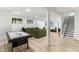 Finished basement featuring an air hockey table, a sectional couch, and stairs to the main floor at 6078 Hardwick Dr, Whitestown, IN 46075