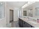 Bathroom features a granite countertop, double sink vanity and tiled shower at 6078 Hardwick Dr, Whitestown, IN 46075
