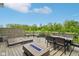 Outdoor deck with a fire pit, seating, and views of a vast green landscape at 6078 Hardwick Dr, Whitestown, IN 46075