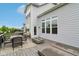 Exterior home view of the deck area, which features a fire pit and outdoor seating at 6078 Hardwick Dr, Whitestown, IN 46075