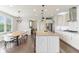 Spacious kitchen with island seating, stainless steel appliances, and an adjacent dining area at 6078 Hardwick Dr, Whitestown, IN 46075