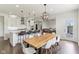 Open kitchen and dining area with stainless appliances, a large island, and stylish seating at 6078 Hardwick Dr, Whitestown, IN 46075