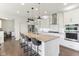 Modern kitchen with a large island, stainless steel appliances, and sleek cabinetry at 6078 Hardwick Dr, Whitestown, IN 46075