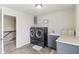 Well-lit laundry room with washer/dryer, folding counter and a window providing natural light at 6078 Hardwick Dr, Whitestown, IN 46075