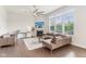 Spacious living room featuring large windows, a fireplace, and comfortable seating at 6078 Hardwick Dr, Whitestown, IN 46075