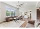 Open-concept living room with hardwood floors and seamless connection to the kitchen and dining area at 6078 Hardwick Dr, Whitestown, IN 46075