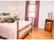 Charming bedroom with a comfortable bed, soft lighting, and a relaxing ambiance at 6126 Rucker Rd, Indianapolis, IN 46220