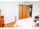 Comfortable bedroom with light-colored walls, hardwood floors, and ample natural light at 6126 Rucker Rd, Indianapolis, IN 46220