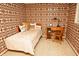 Bedroom features vibrant wallpaper, a cozy bed, and a wooden desk with chair at 6126 Rucker Rd, Indianapolis, IN 46220