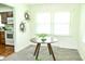 Bright dining room with a modern table and view of kitchen at 6126 Rucker Rd, Indianapolis, IN 46220