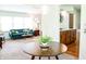 Bright dining room with a modern table and view of a bright living room at 6126 Rucker Rd, Indianapolis, IN 46220