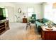 Bright living room with neutral carpet, a modern sofa, and plenty of natural light at 6126 Rucker Rd, Indianapolis, IN 46220