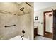 Updated bathroom features tiled shower with glass door and convenient grab bar at 6190 S 425 W, Pendleton, IN 46064
