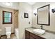 Well-lit bathroom with granite countertop, tiled floors, and a shower-tub combination at 6190 S 425 W, Pendleton, IN 46064