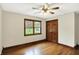 Charming bedroom with hardwood floors, ceiling fan, and natural light from window at 6190 S 425 W, Pendleton, IN 46064