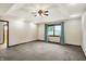 Large bedroom with tray ceiling, ceiling fan, and large window views at 6190 S 425 W, Pendleton, IN 46064