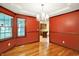 Inviting dining room showcasing hardwood floors, a beautiful chandelier, and natural lighting at 6190 S 425 W, Pendleton, IN 46064