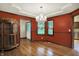 Charming dining room featuring hardwood floors, a glass cabinet, and access to kitchen at 6190 S 425 W, Pendleton, IN 46064