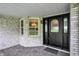 Inviting front porch featuring detailed trim work and an elegant glass front door at 6190 S 425 W, Pendleton, IN 46064