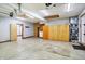 Spacious garage with painted concrete floors and built-in storage cabinets at 6190 S 425 W, Pendleton, IN 46064