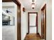 A hallway with custom wood trim and a view of the living room at 6190 S 425 W, Pendleton, IN 46064