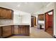 A kitchen with custom wood cabinets, granite countertops, and a dining area at 6190 S 425 W, Pendleton, IN 46064