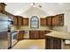 Updated kitchen features stainless steel appliances, granite countertops, and wood cabinetry at 6190 S 425 W, Pendleton, IN 46064