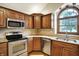Updated kitchen features stainless steel appliances, granite countertops, and a corner window at 6190 S 425 W, Pendleton, IN 46064
