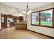 A kitchen with custom wood cabinets, stainless appliances, granite countertops, and a dining area at 6190 S 425 W, Pendleton, IN 46064