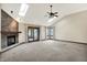 Bright living room with stone fireplace, skylights, and multiple windows at 6190 S 425 W, Pendleton, IN 46064