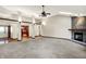 Open concept living room with fireplace, skylights, and natural light at 6190 S 425 W, Pendleton, IN 46064