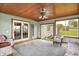 Cozy sunroom with wood ceiling, tile floor, and view of the back yard at 6190 S 425 W, Pendleton, IN 46064