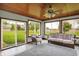 Bright sunroom with multiple windows and sliding door to the backyard at 6190 S 425 W, Pendleton, IN 46064