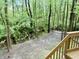 Spacious backyard featuring a stream and woodsy views with stairway access at 6242 Carrington Dr, Indianapolis, IN 46236
