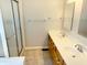 Bathroom featuring a double sink vanity, a tiled floor, and a shower with glass door at 6242 Carrington Dr, Indianapolis, IN 46236