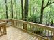 Wooden deck overlooking a lush, green wooded area offering peaceful outdoor living at 6242 Carrington Dr, Indianapolis, IN 46236