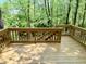 Wooden deck overlooking a lush, green wooded area offering peaceful outdoor living at 6242 Carrington Dr, Indianapolis, IN 46236