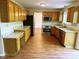 Spacious kitchen with stone countertops, oak cabinets, and stainless steel appliances at 6242 Carrington Dr, Indianapolis, IN 46236
