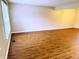 Living room featuring wood floors, neutral paint and a window bringing in natural light at 6242 Carrington Dr, Indianapolis, IN 46236