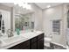 Modern bathroom features dual sinks, a quartz countertop, and a stylish tiled shower at 6463 Wasco Dr, Whitestown, IN 46075