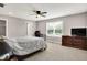 Primary bedroom with an en suite bath, closet, desk and TV at 6463 Wasco Dr, Whitestown, IN 46075