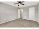 Bedroom features neutral carpeting and a ceiling fan at 6463 Wasco Dr, Whitestown, IN 46075