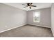 Bedroom features neutral paint, carpeted floors, and a window offering natural light at 6463 Wasco Dr, Whitestown, IN 46075