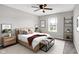 Cozy bedroom featuring a ceiling fan, plush bedding, and modern furnishings with natural light at 6463 Wasco Dr, Whitestown, IN 46075
