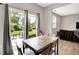 Bright dining area features sliding glass doors leading to a patio and backyard view at 6463 Wasco Dr, Whitestown, IN 46075