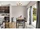 The bright dining area is next to the kitchen and has a sliding glass door to the patio at 6463 Wasco Dr, Whitestown, IN 46075